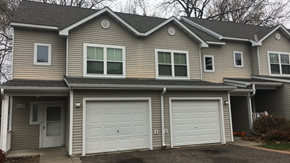White Bear Lake townhouse for rent - a tan house with two garage doors
