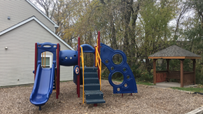 White Bear Lake townhouse for rent - a playground with a swing set and other playground equipment