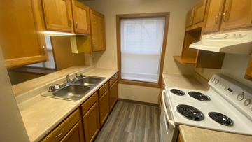 White Bear Lake townhouse for rent - a kitchen with a stove and a sink