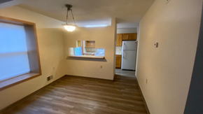 White Bear Lake townhouse for rent - an empty living room with a kitchen and a window