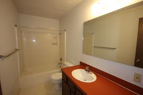 Whitefish apartment for rent - A bathroom with a toilet, sink, and shower.