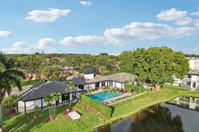 Sunrise apartment for rent - A house with a pool in the backyard.