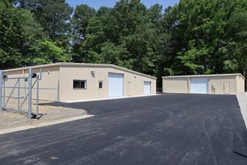 N.Chesterfield apartment for rent - A large industrial building with a grey roof and a white garage door.