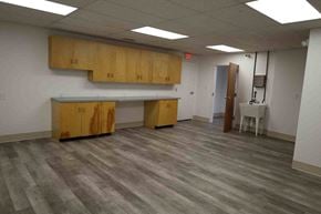 N.Chesterfield apartment for rent - A room with wooden cabinets and grey flooring.