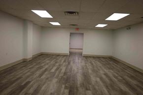N.Chesterfield apartment for rent - A room with wooden flooring and a white door in the middle.