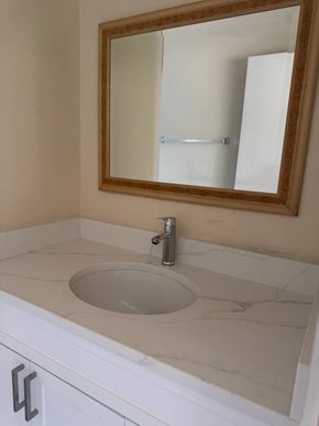 Burnaby apartment for rent - A bathroom sink with a mirror above it.