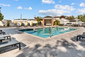 Ammon apartment for rent - Swimming Pool with lounge seating surrounding perimeter at Eagles Landing, Ammon, Idaho