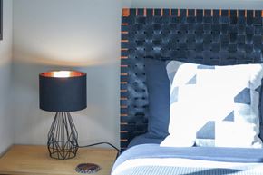 Pagosa Springs house for rent - a bedroom with a bed and a lamp on a table