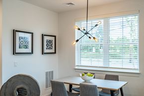 Norwell apartment for rent - a dining room with a table and chairs and a chandelier