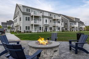 Norwell apartment for rent - an outdoor fire pit in front of an apartment building