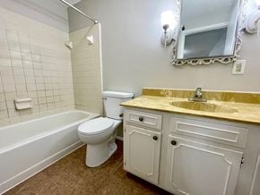 Louisville house for rent - a bathroom with a sink toilet and a bath tub