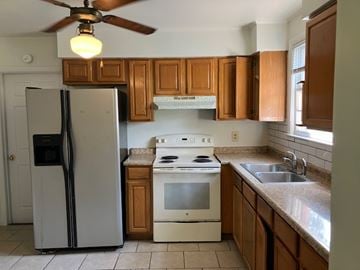 Beaufort  - Coming Available 8/1/26 house for rent - a kitchen with a stove refrigerator and a sink