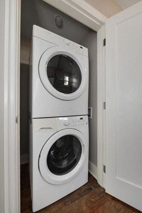 Victoria apartment for rent - a washing machine and dryer in a small closet