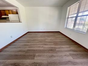 Shepherdsville apartment for rent - an empty living room with wood flooring and a window