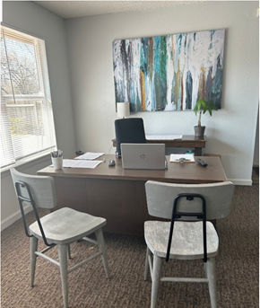 Wichita apartment for rent - a home office with two chairs and a desk with a laptop