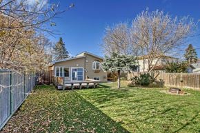 Edmonton house for rent - a small house with a yard and a fence