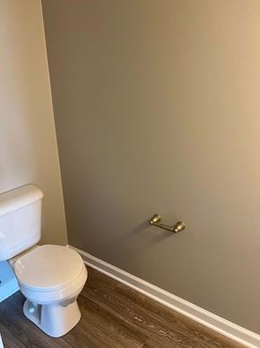 Shelbyville apartment for rent - a bathroom with a toilet and a toilet paper roll on the wall