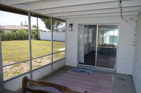 Cape Coral house for rent - screened in porch with dining room in the background