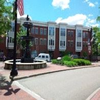 Warren apartment for rent - a city street with a building and a fountain