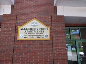 Warren apartment for rent - a sign on the side of a brick building saying allegheny point apartments