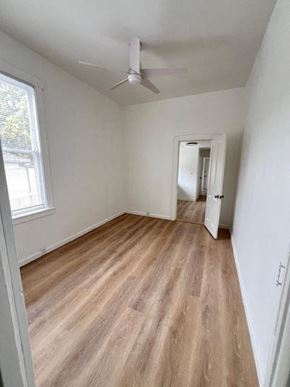 Santa Barbara apartment for rent - a living room with a wood floor and a ceiling fan