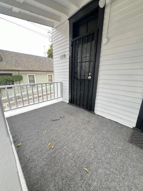 Santa Barbara apartment for rent - a front porch of a house with a black door