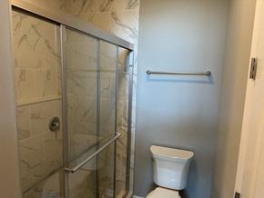 Cranberry Township apartment for rent - a bathroom with a toilet and a glass shower