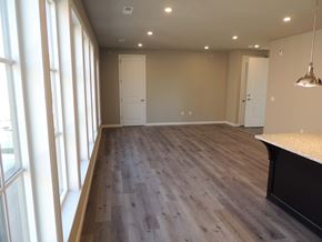 Cranberry Township apartment for rent - a renovated living room and dining room with wood flooring