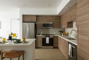 Sacramento apartment for rent - A modern kitchen with wooden cabinets and stainless steel appliances.