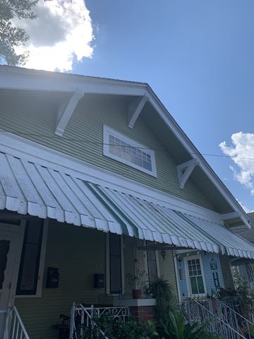 New Orleans apartment for rent - A house with a blue front and white trim.