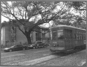 New Orleans apartment for rent - A black and white photo of a tram on a city street.