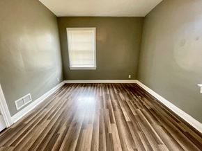 Louisville apartment for rent - A room with wooden flooring and a window.