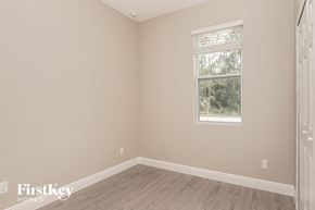 Palm Bay house for rent - a bedroom with a window and a wooden floor