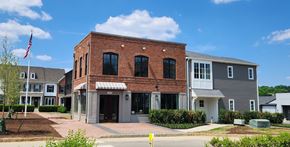 Bridgeville apartment for rent - a brick building with an flag in front of it