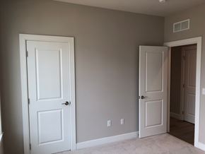 Bridgeville apartment for rent - a bedroom with two white doors and a hallway with a door open to a closet