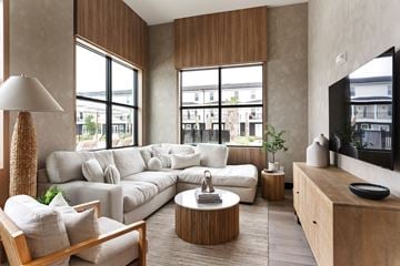 Lakeland apartment for rent - A living room with a white couch and a wooden coffee table.