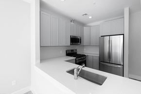 Hackensack apartment for rent - an empty kitchen with a sink and a refrigerator