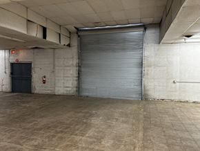 Garland apartment for rent - a large roll up door in a large room
