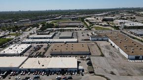 Garland apartment for rent - an aerial view of an industrial parking lot and buildings