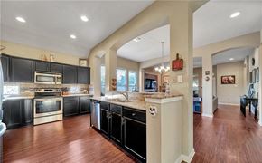 Killeen house for rent - a large kitchen with black cabinets and a counter top