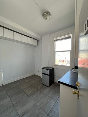 Oakland apartment for rent - A room with a window, a door, and a counter.