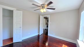 Bay City house for rent - an empty living room with a ceiling fan