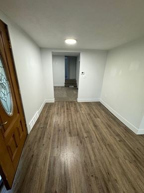 Belding house for rent - a living room with wood floors and white walls