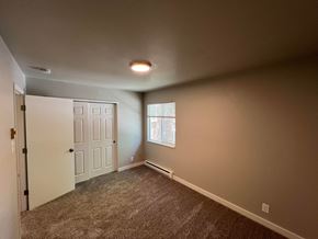 Fort Collins apartment for rent - an empty living room with carpet and a window