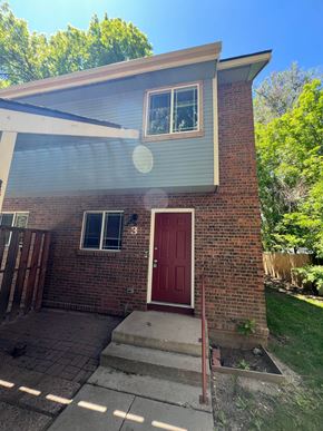 Fort Collins apartment for rent - the front of a brick house with a red door
