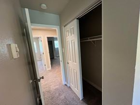 Fort Collins apartment for rent - a bedroom with a closet and a door open to a hallway