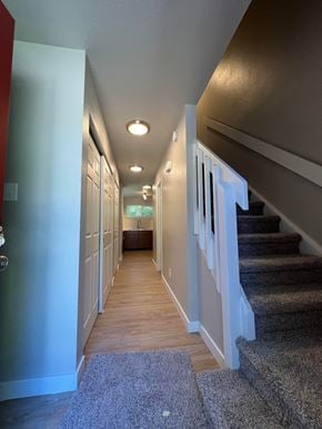 Fort Collins apartment for rent - a look down the hallway of a house with stairs
