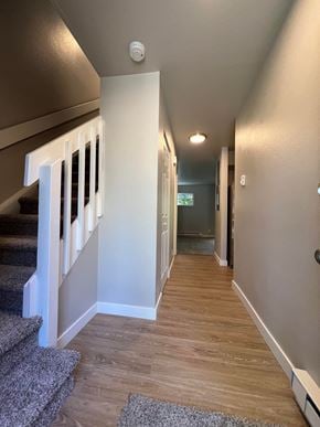 Fort Collins apartment for rent - a view down the hallway of a house with stairs and carpeting