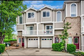 Boulder apartment for rent - the front of a house with two garage doors and a balcony