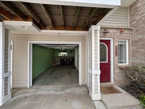 Boulder apartment for rent - the entrance to a parking garage with a red door and a green wall